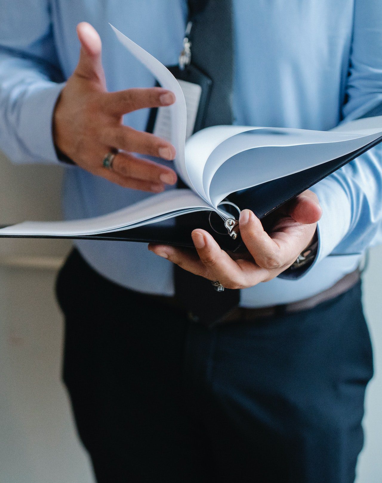 Businessman reading documents in office<br />
